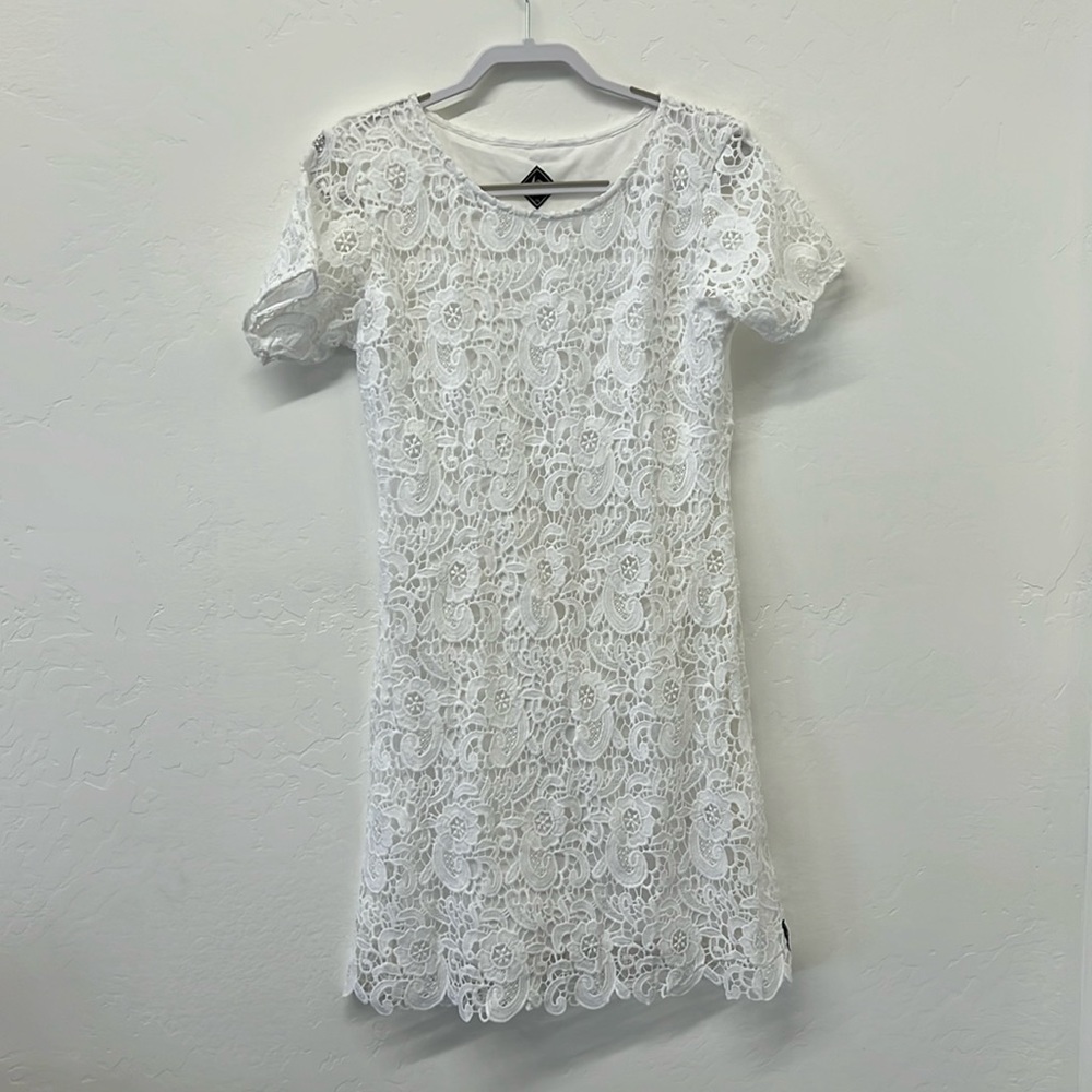 White crocheted dress. Great for running around in the summer.